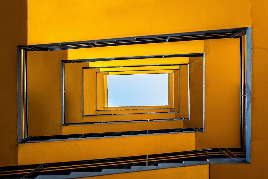 rectangular spiral staircase, low angle photography of building interior HD wallpaper