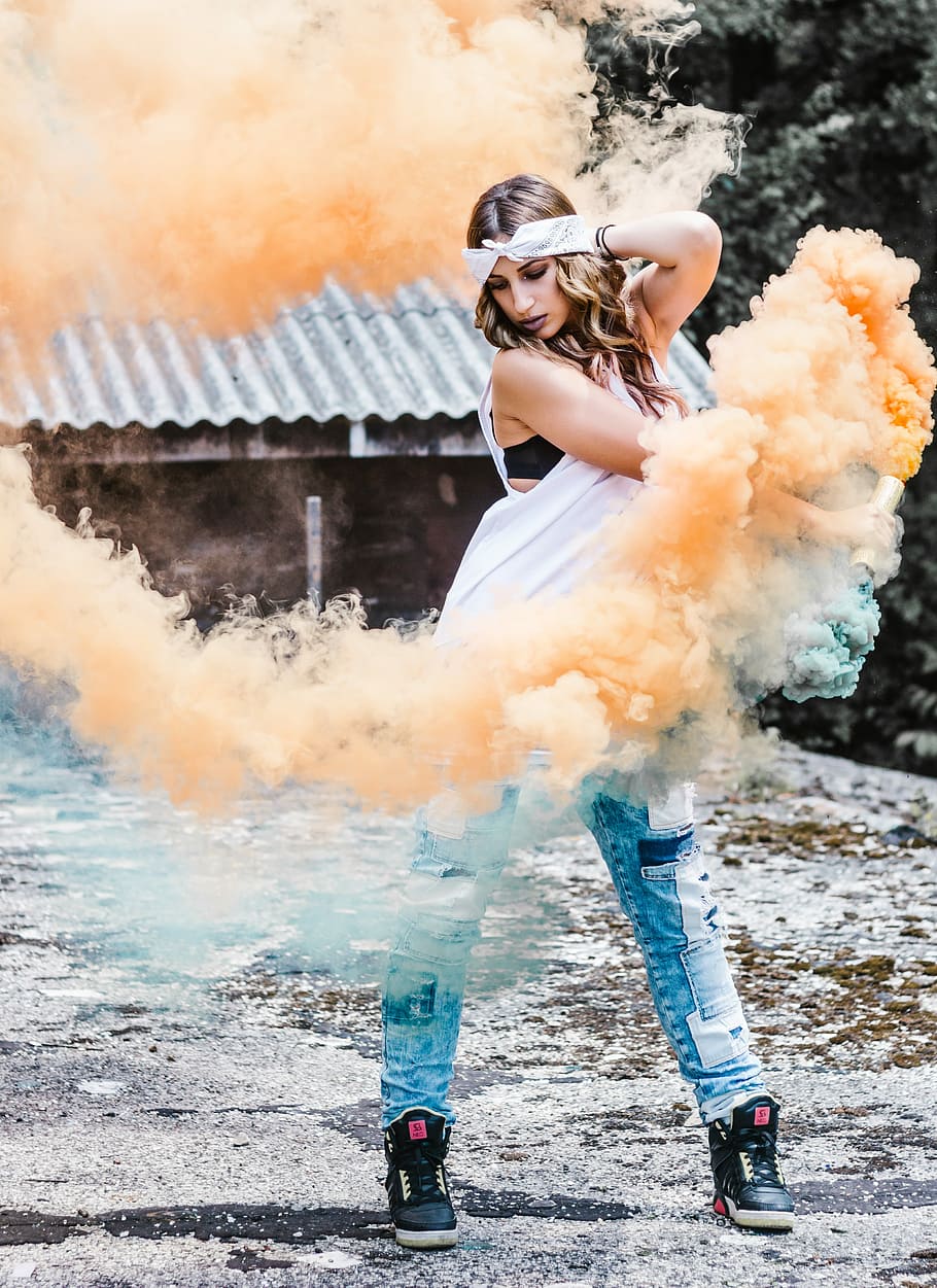 Pyro girl, woman holding a orange smoke bottle, bomb, female, HD wallpaper