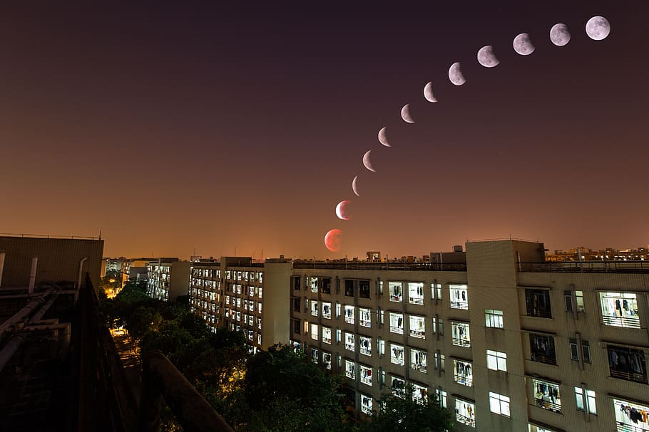 white concrete building under moon at nighttime, lunar eclipse HD wallpaper