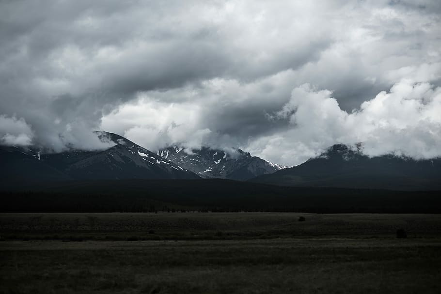 mountains covered by clouds, landscape photo of a mountain and nimbus clouds HD wallpaper