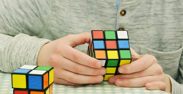 person holding 3 by 3 Rubik's cube, magic cube, patience, tricky HD wallpaper