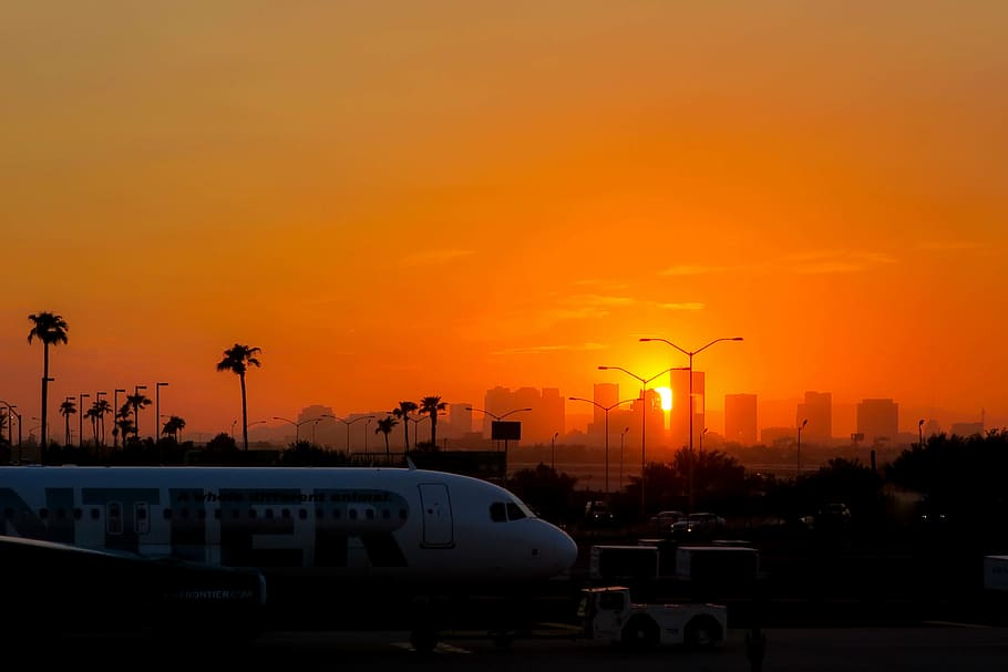 white and red plane on gray pavement, airplane, orange, sky HD wallpaper