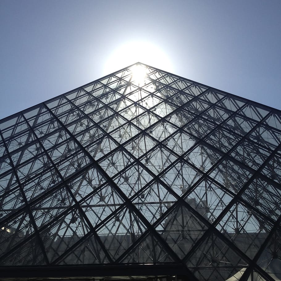 low-angle photography of glass pyramid building at daytime HD wallpaper