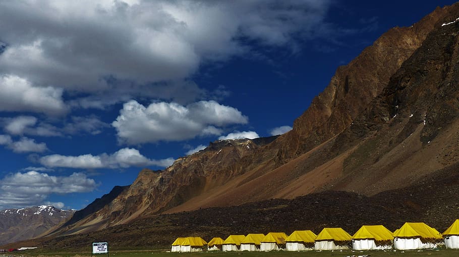 tent on mountain foot, houses near body of mountain, camp, base camp HD wallpaper