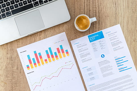 two printed paper beside mug and laptop, chart, graph, finance HD wallpaper