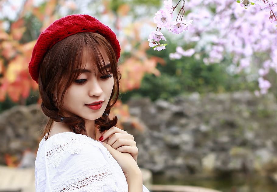 woman wearing red knit cap and white top, flower, cherry flowers HD wallpaper