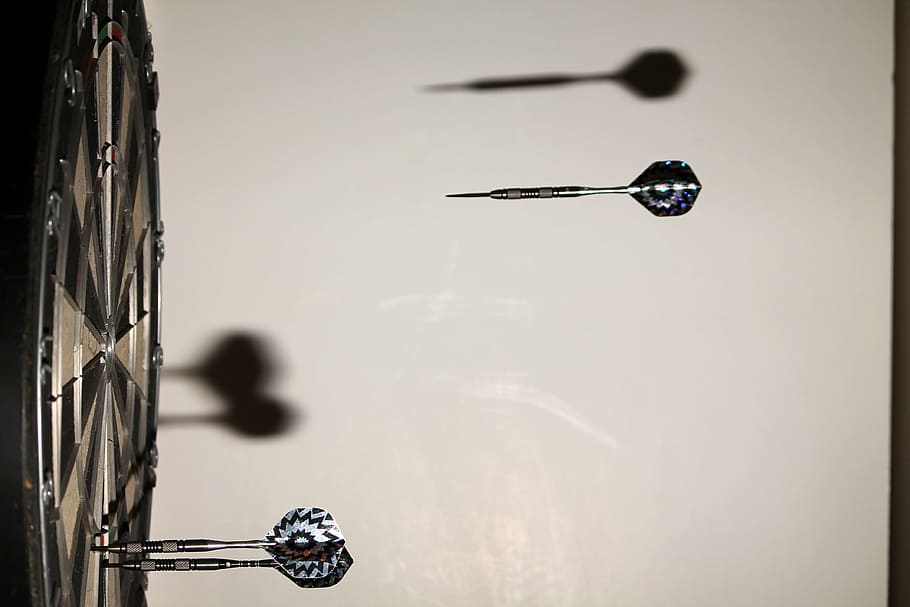 three grey grey dart pins, dart board, motion, stop action HD wallpaper