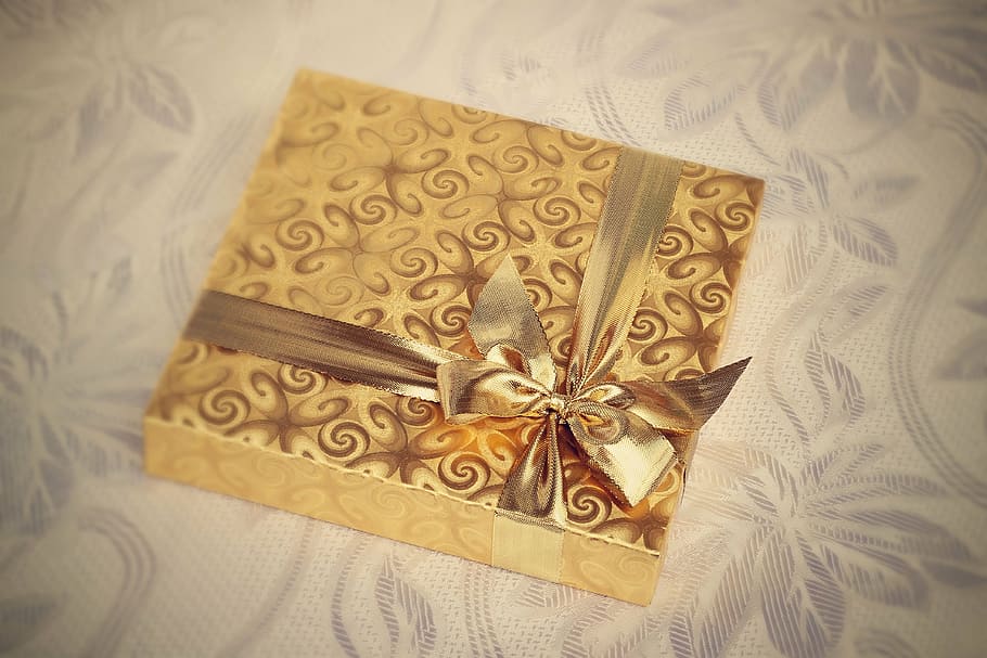 brown box on white textile, gift, present, background, recreation HD wallpaper