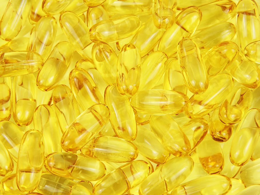 closeup photo of soft gels, yellow, jelly, pills, lot, capsule HD wallpaper