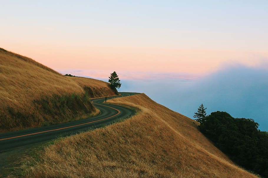 wave pathway at the top of mountain, road near cliff and mountain HD wallpaper