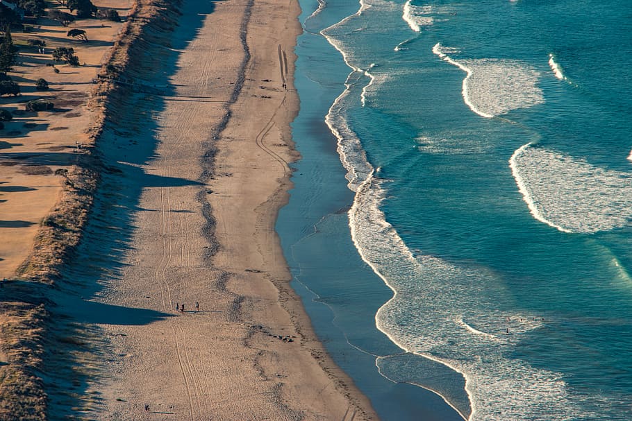 aerial photo of brown sandy beach, top view photography of body of water HD wallpaper