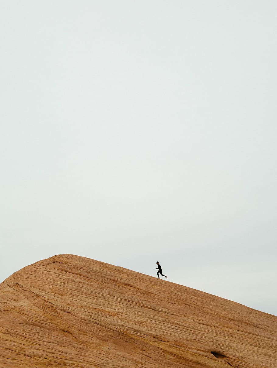 person running on top on hill during daytime, man running on top of hill during daytime HD wallpaper