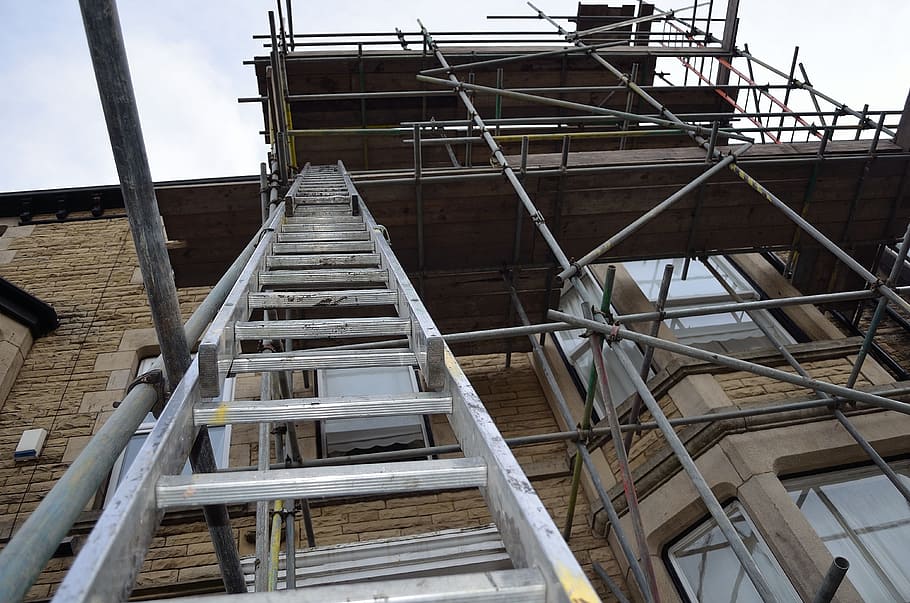empty gray metal scaffolding under white sky during daytime HD wallpaper