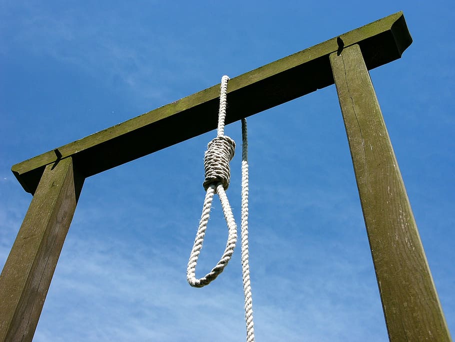 rope hanging on arch, gallows, blue sky, wooden frame, loop, low angle view