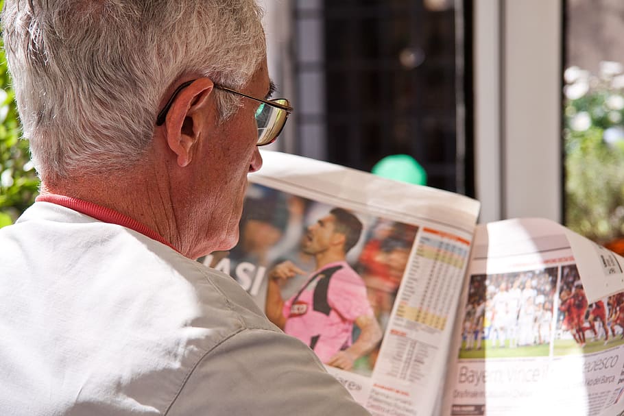 man reading newspaper, pensioners, messages, lack of understanding