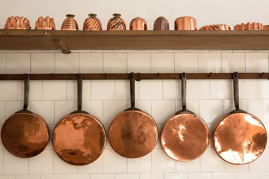 brass-colored and black cookware set, pans, copper, old, baking moulds