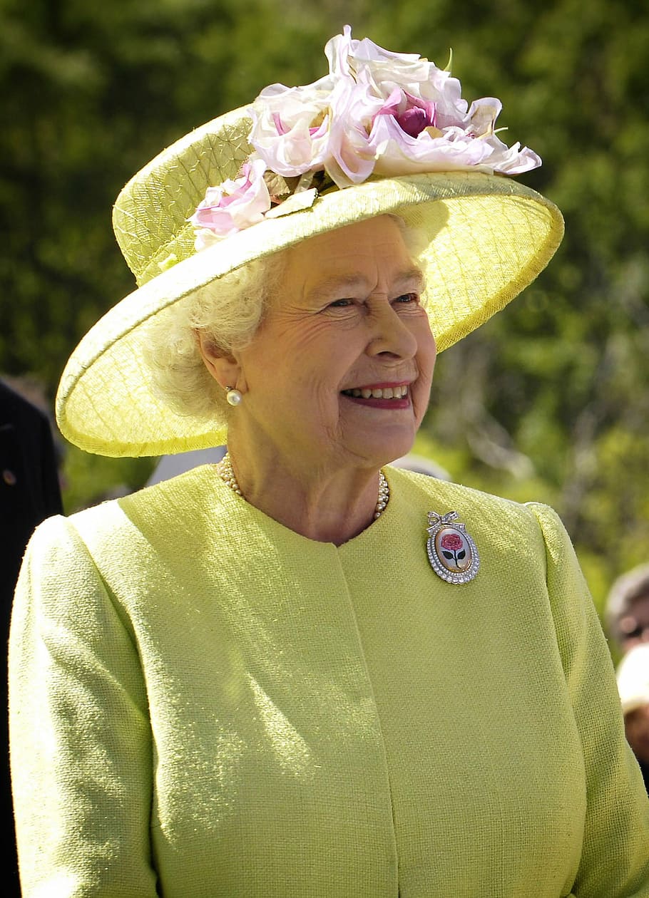 Queen Elizabeth II wearing yellow sun hat, england, portrait