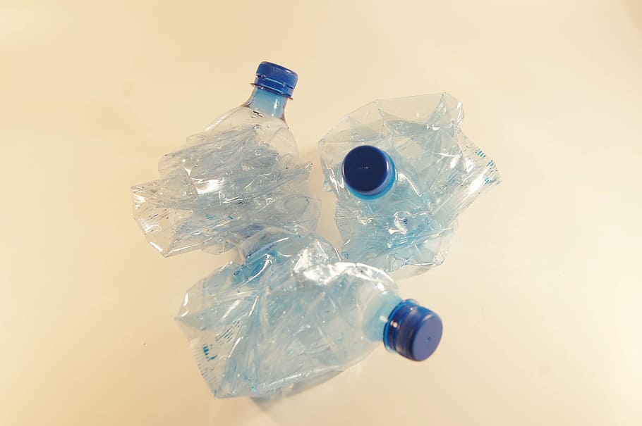 three blue plastic bottles, recycling, by participating in, garbage