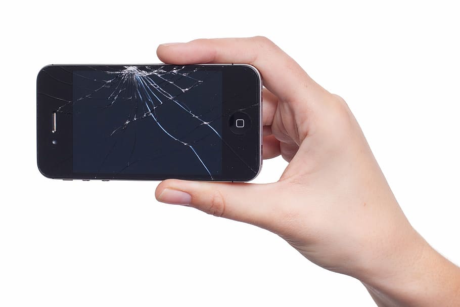 person holding cracked iPhone 4, apple, display, damage, broken
