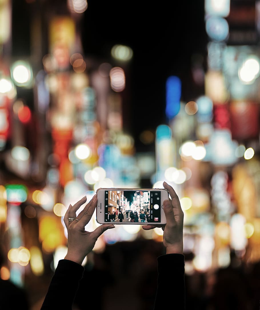 The city is my church, selective focus photo of person capturing the high-rise buildings HD wallpaper