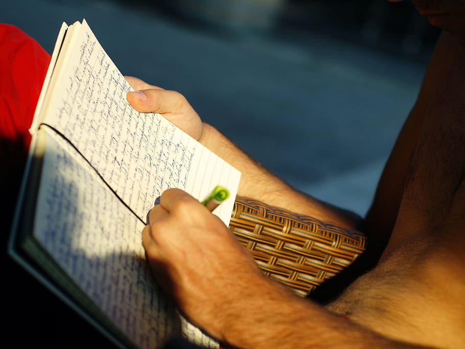 person writing on black line notebook, pen, paper, hand, write HD wallpaper