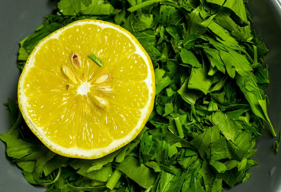 lemon slice on green vegetable, still life, greens, food, freshness HD wallpaper