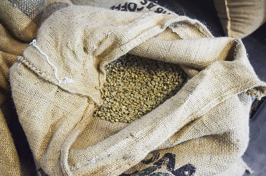 open sack filled with grains, coffee, beans, espresso, raw, uncooked