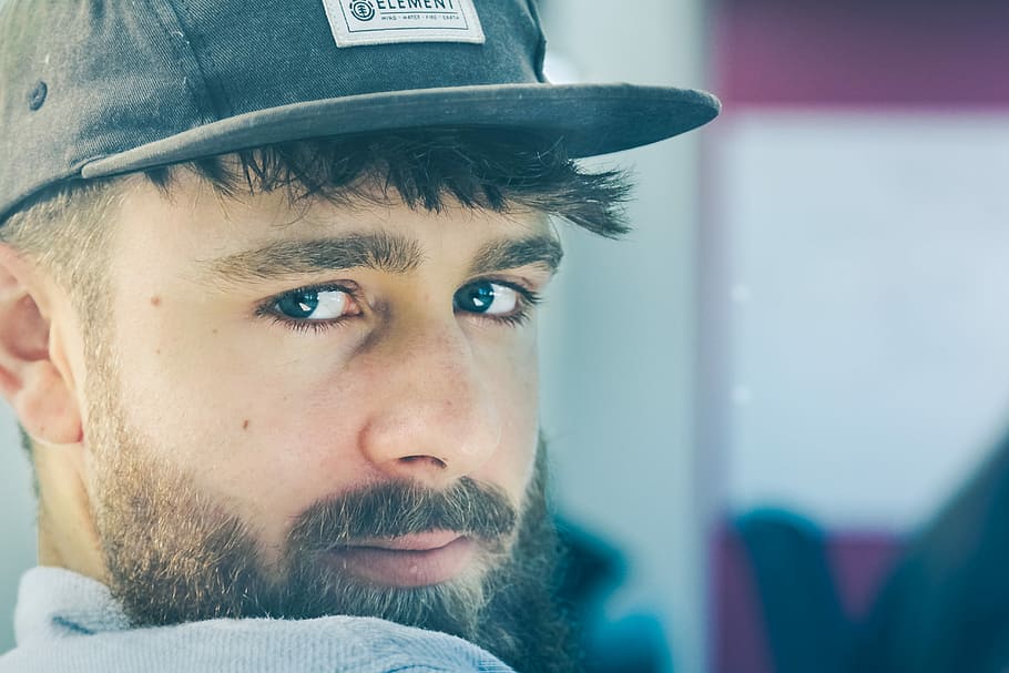 person wearing fitted cap, man looking at the camera, male, beard HD wallpaper