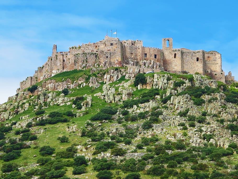 brown concrete building on green grass cliff, castle, hilltop HD wallpaper