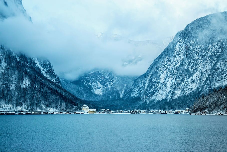 landscape photography of mountain alps near houses, panoramic photo of snow covered mountain HD wallpaper