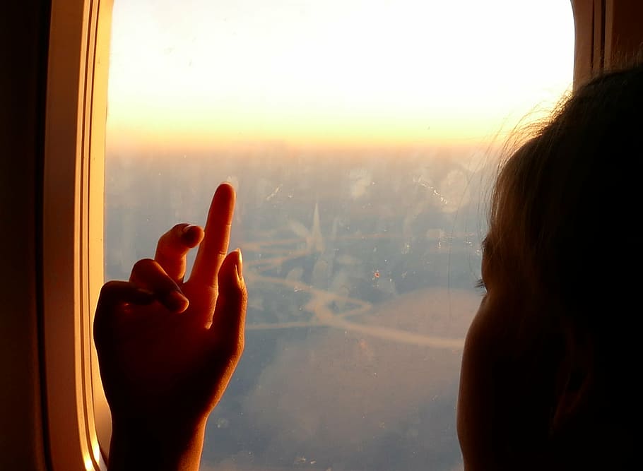 girl facing sideways, hand, airplane window, child, pointing, HD wallpaper