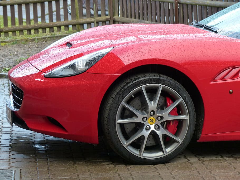 red Ferrari vehicle parked near wooden fence at daytime, auto HD wallpaper