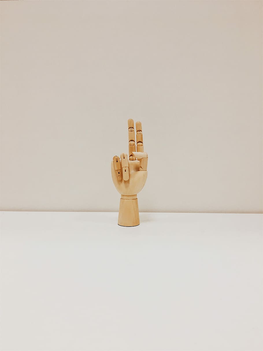 brown wooden hand, hand wooden decor top of white area, indoors HD wallpaper
