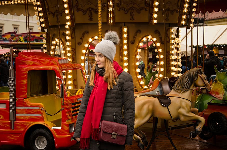 woman standing near lighted carousel, woman standing near red truck HD wallpaper