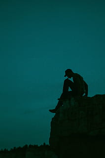 silhouette photo of man sitting at cliff, edge, stone, guy HD wallpaper