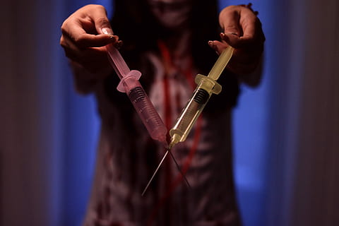 person holding two yellow and red Syringe, music, musician, musical Instrument HD wallpaper