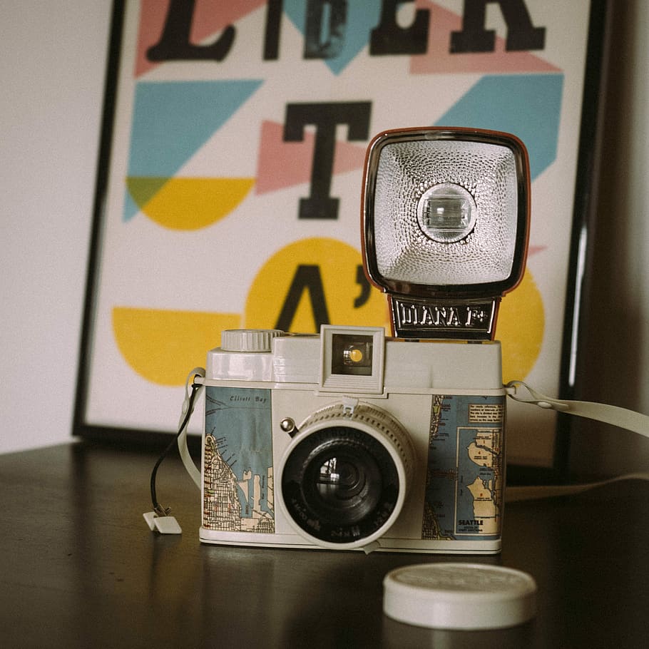 white and green camera on table, close up photography of gray and blue camera HD wallpaper