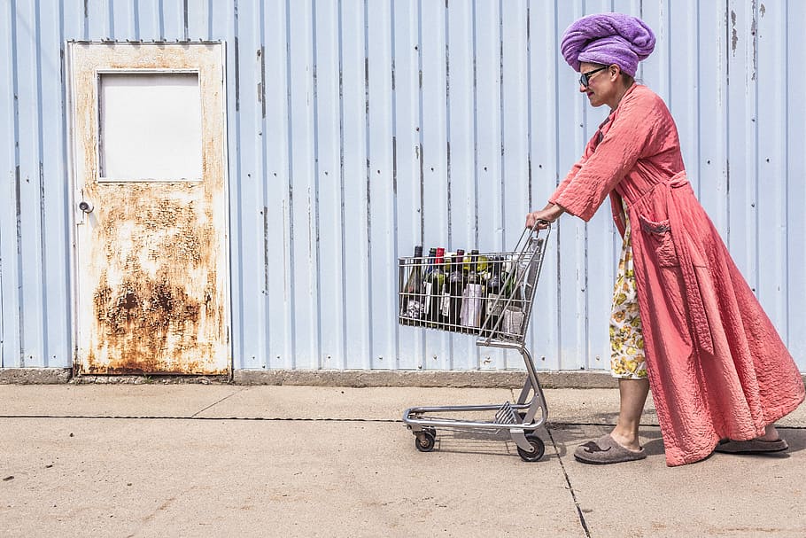 man in pink bathrobe pushing cart outdoors at daytime, people HD wallpaper