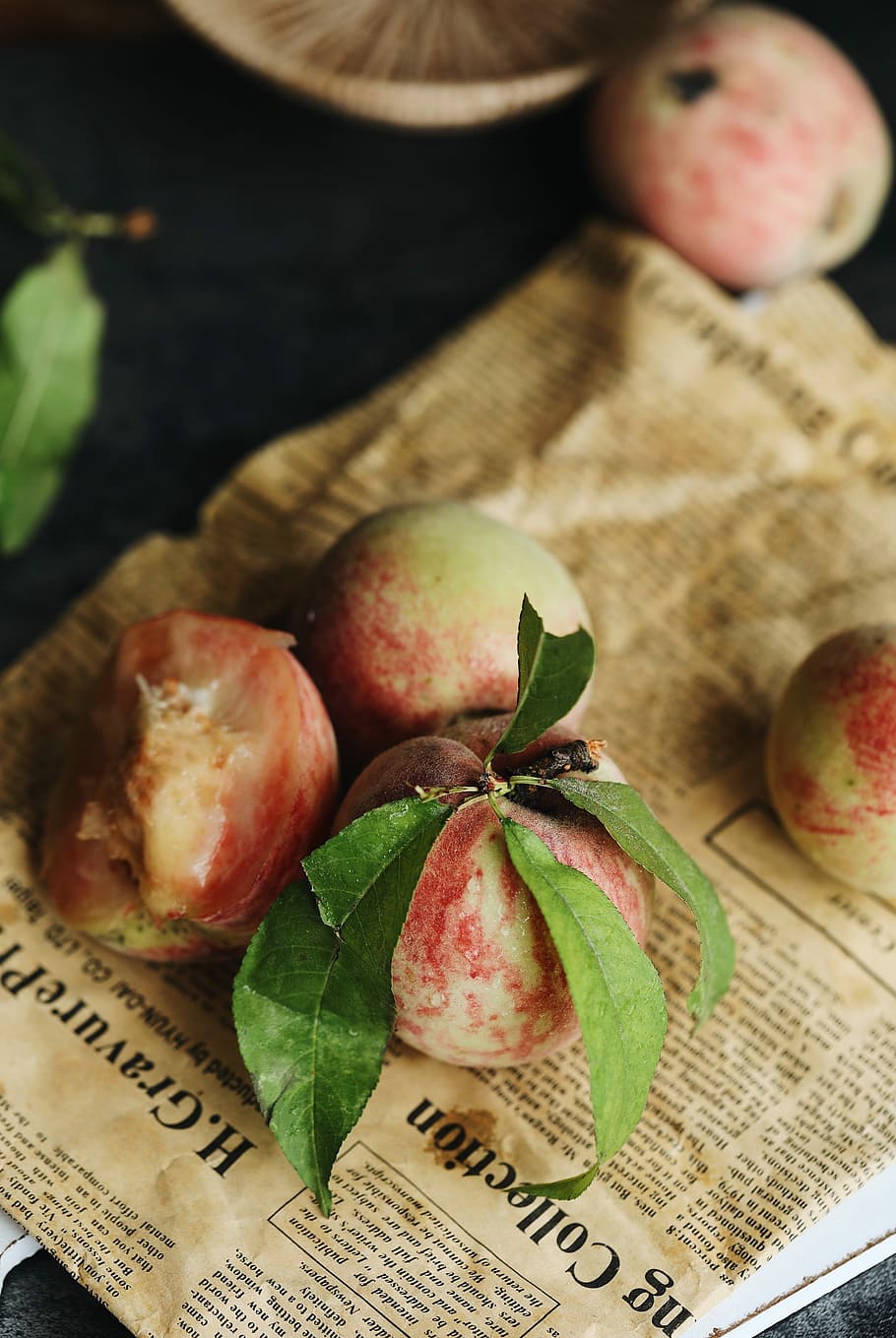 peach fruit on newspaper, three round fruits, healthy eating HD wallpaper