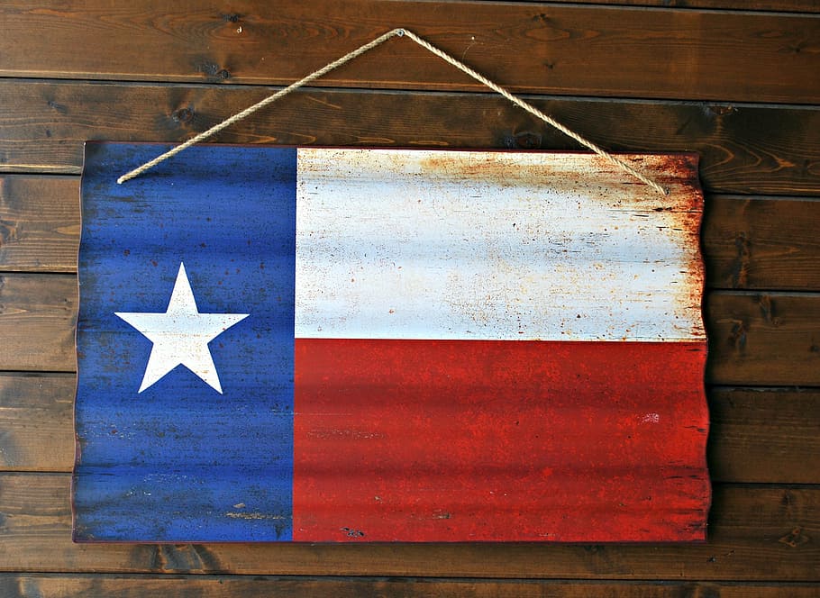 flag of Chile wall decor hanged on brown wall, texas flag, star