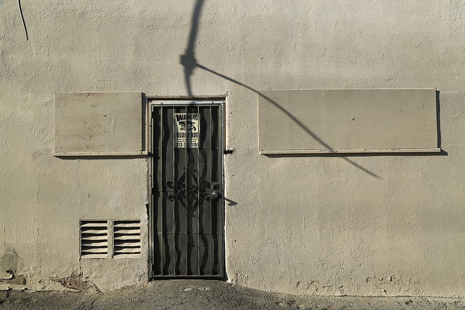 Back of the Building, black metal door frame between gray concrete wall at daytime HD wallpaper