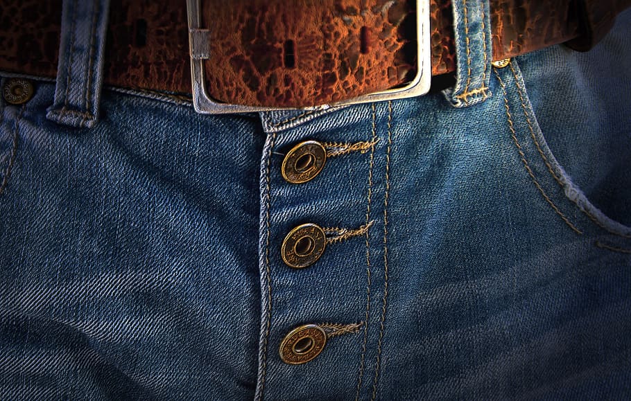 closeup photo of denim bottoms with brown belt, belts, buckle