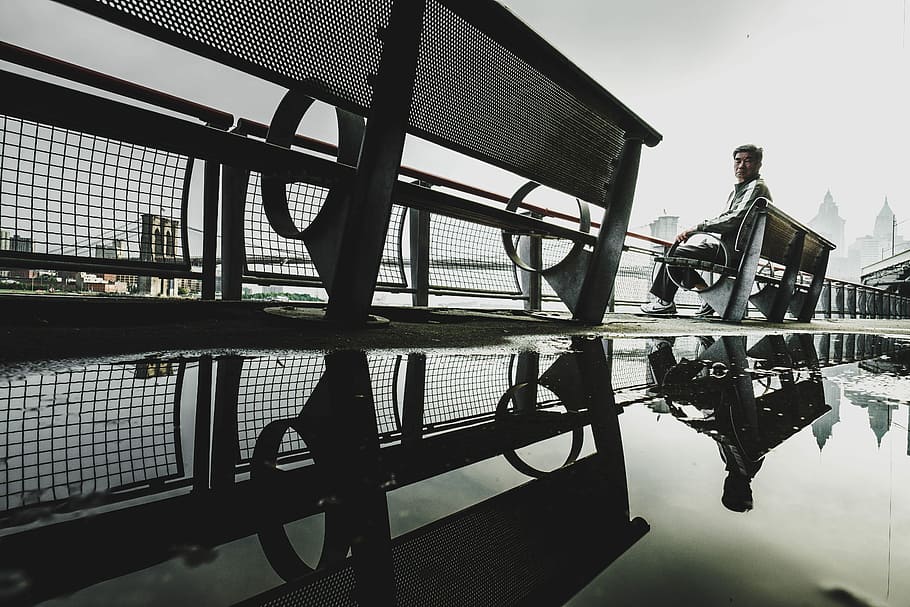 man sitting on bench, worm's eye view of man sitting on bench HD wallpaper