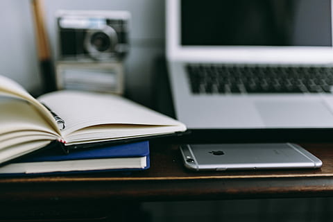 Elegant workspace with Macbook, iPhone, business cards and notebooks HD wallpaper