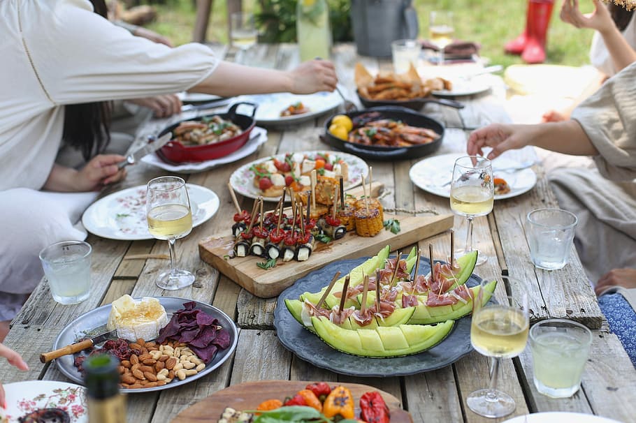 group of people eating on backyard, group of persons eating on brown wooden table HD wallpaper