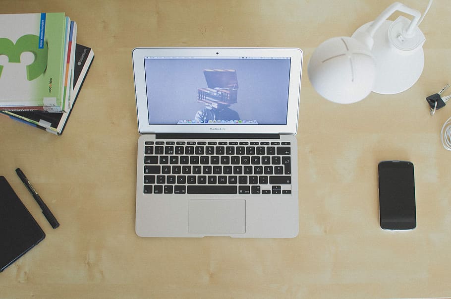 MacBook Air beside black smartphone, desk, office, laptop, computer HD wallpaper
