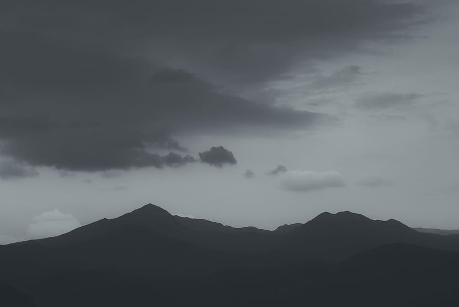 silhouette photography of mountain during daytime, silhouette of mountain under gray skies HD wallpaper