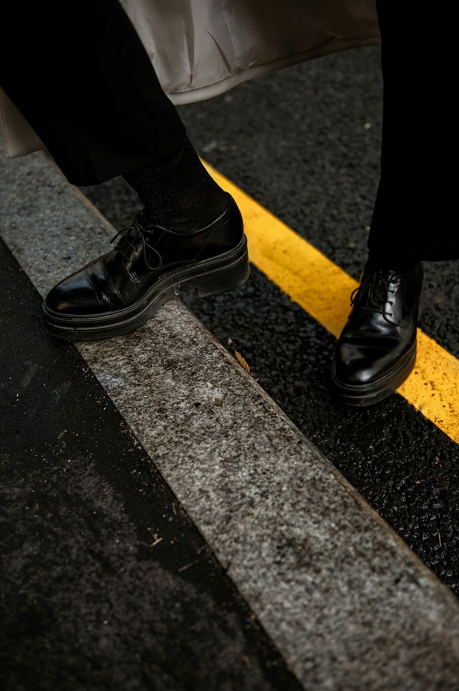 person wearing black patent leather dress shoes, person stepping on road gutter, HD wallpaper