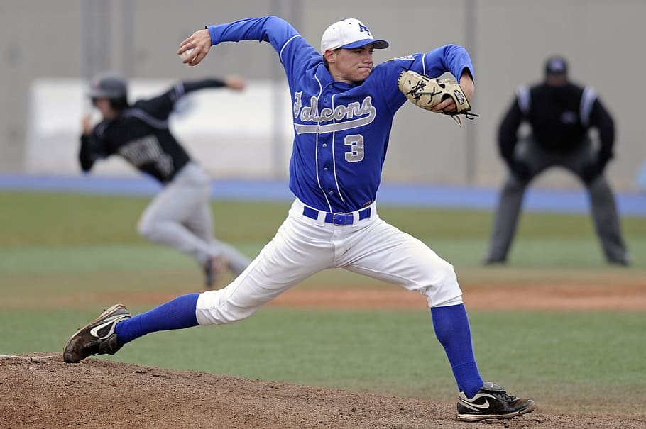 Download A Baseball Player Is Throwing A Ball Wallpaper