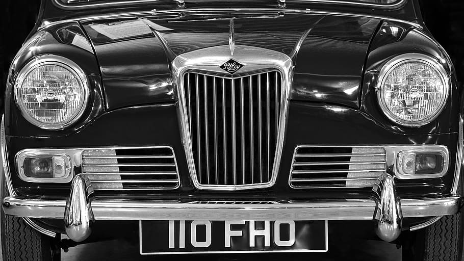 grayscale photography of classic vehicle with NO FHO license plate